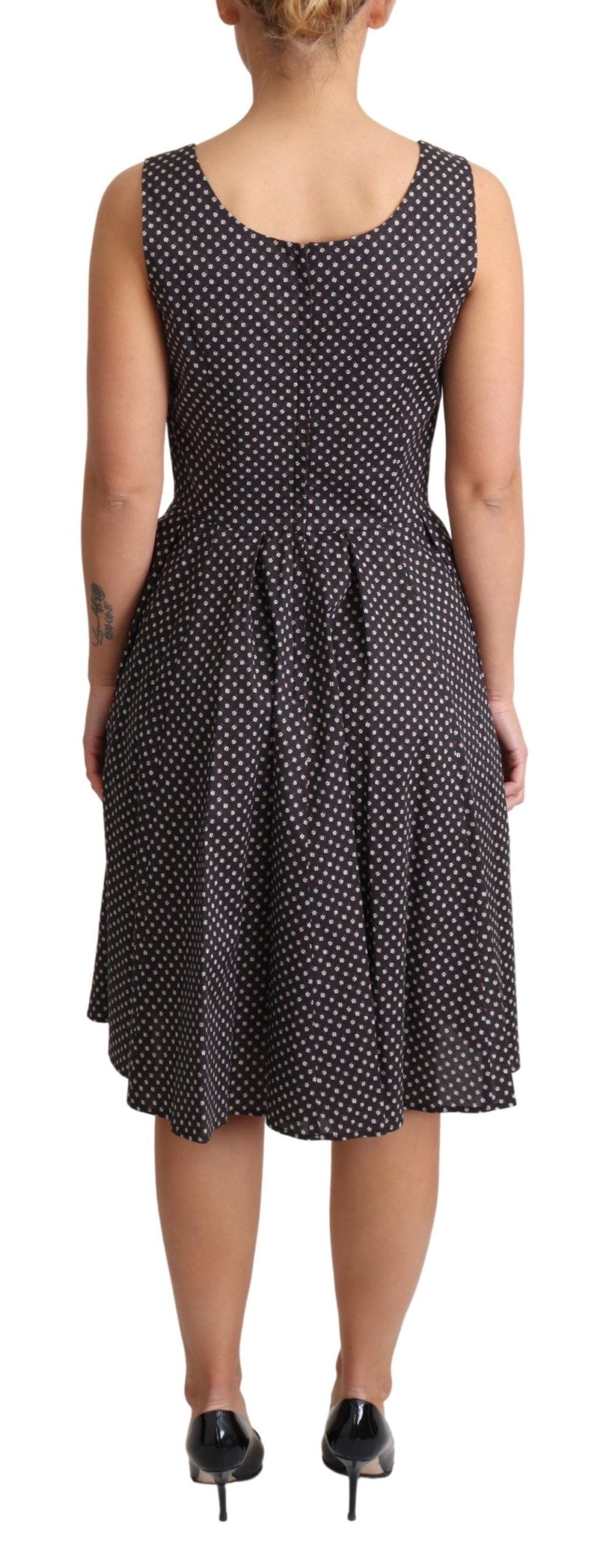 Black floral cotton A-line stretch dress by Dolce & Gabbana, featuring a flowy silhouette and vibrant floral pattern.