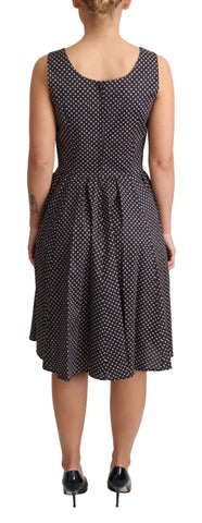 Black floral cotton A-line stretch dress by Dolce & Gabbana, featuring a flowy silhouette and vibrant floral pattern.
