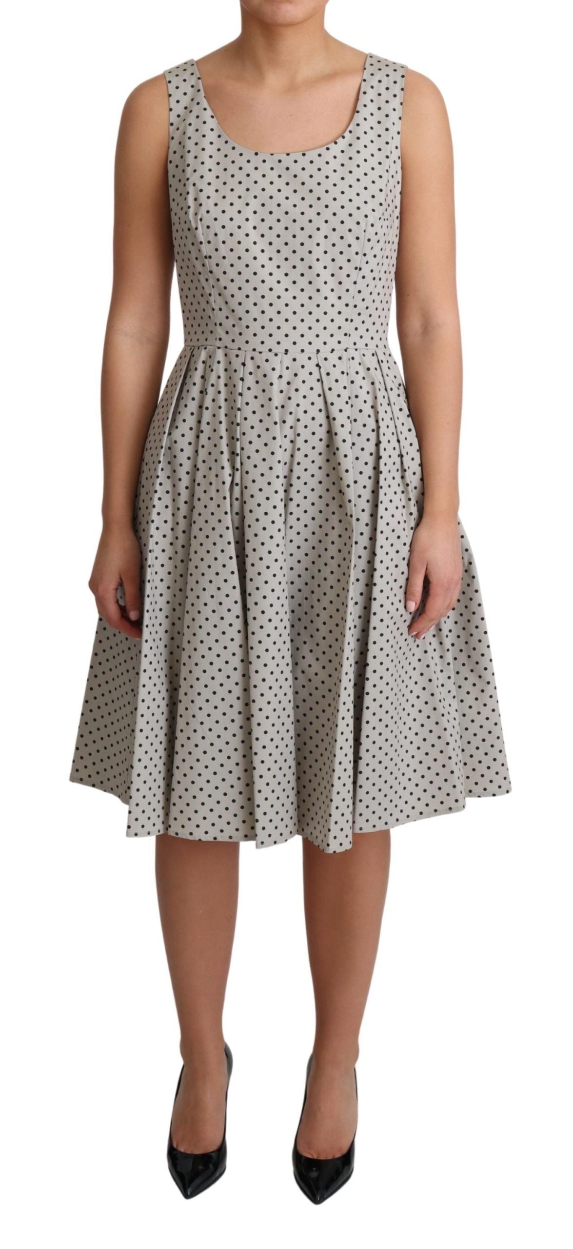 Beige polka dotted cotton A-line dress by Dolce & Gabbana, featuring a flattering silhouette and stylish pattern.