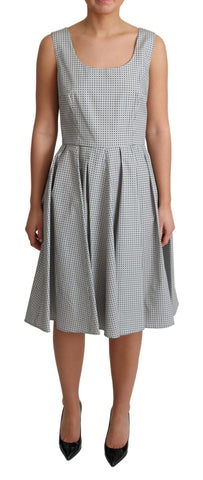 Gray polka dotted cotton A-line dress by Dolce & Gabbana, featuring a fitted bodice and flowing skirt.