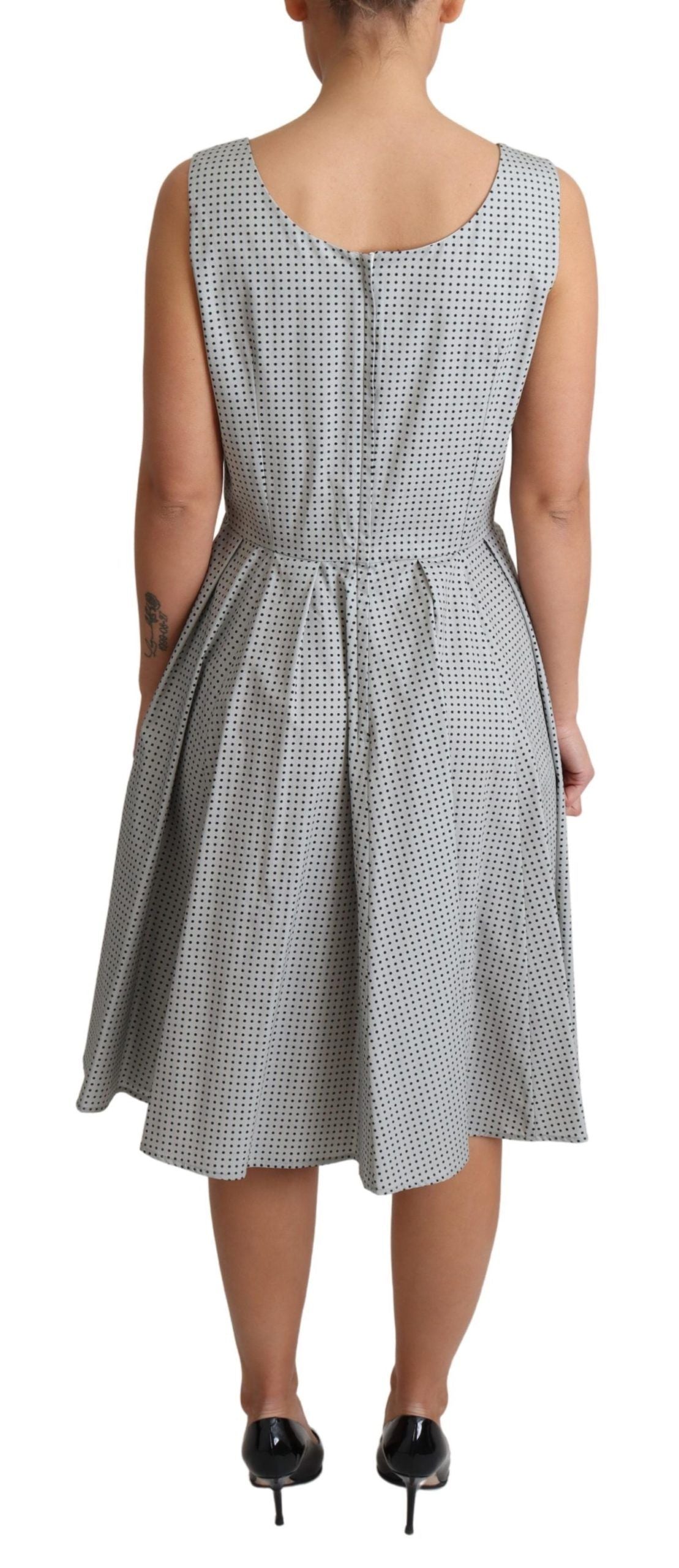 Gray polka dotted cotton A-line dress by Dolce & Gabbana, featuring a fitted bodice and flared skirt.