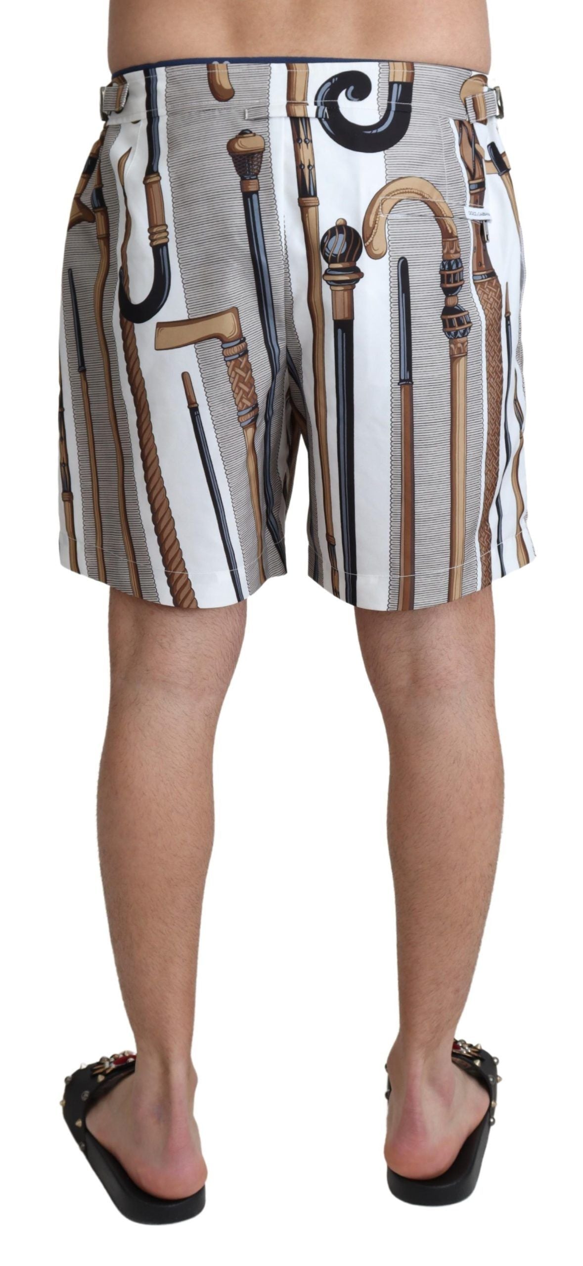 White Dolce & Gabbana walking stick beachwear swim shorts with a relaxed fit and stylish design, perfect for summer beach outings.