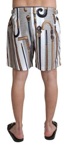White Dolce & Gabbana walking stick beachwear swim shorts with a relaxed fit and stylish design, perfect for summer beach outings.