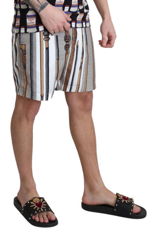 White Dolce & Gabbana swim shorts with a casual fit, designed for beachwear and comfortable walking by the water.