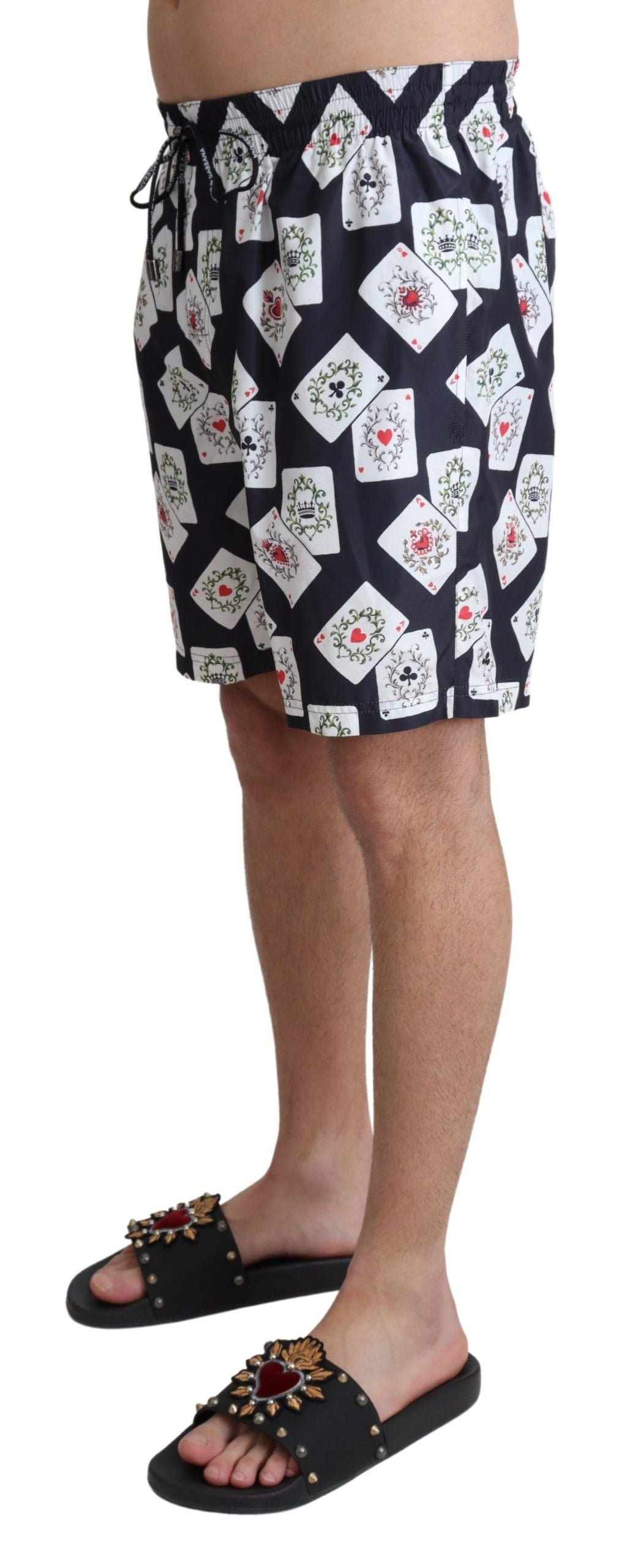 Black beachwear swimshorts with card deck print by Dolce & Gabbana, featuring a relaxed fit and stylish design.