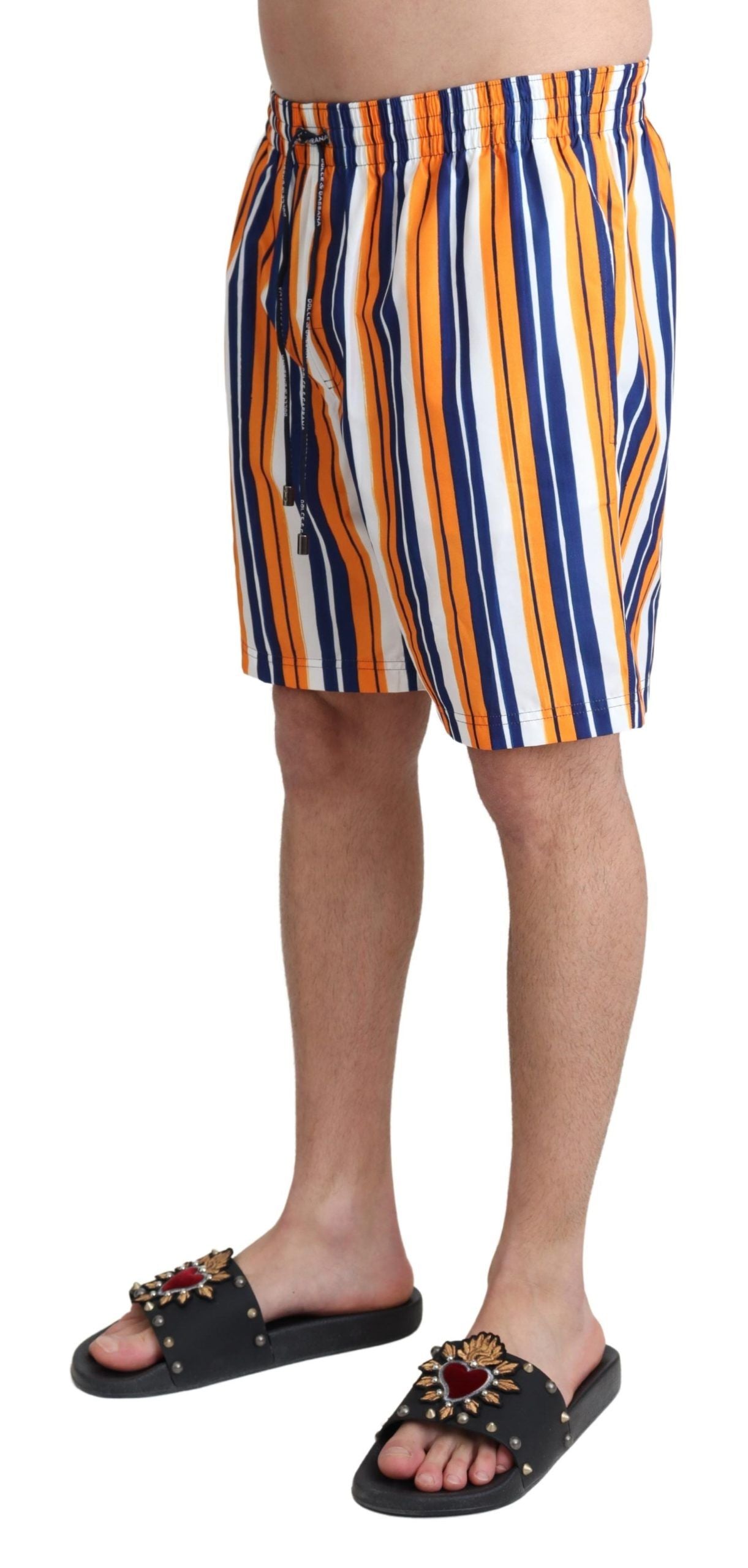 Multicolor striped Dolce & Gabbana beachwear swimshorts with vibrant pattern and comfortable fit, perfect for summer swimming.