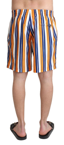 Multicolor striped Dolce & Gabbana beachwear swimshorts with vibrant pattern and lightweight fabric, suitable for swimming and beachwear.