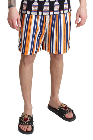 Multicolor striped Dolce & Gabbana beachwear swimshorts with vibrant patterns and lightweight fabric for swimming and beach outings.