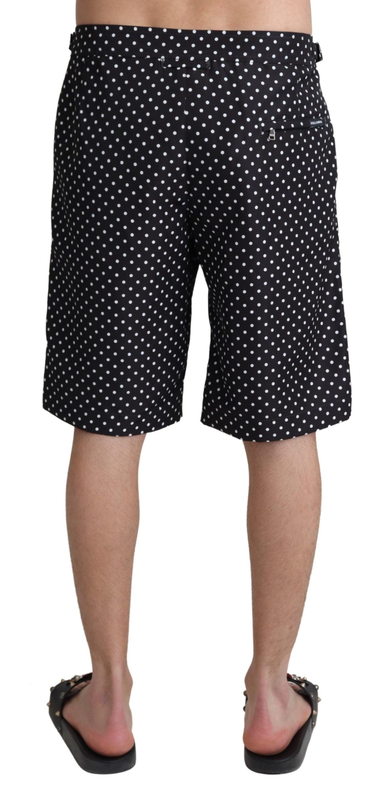 Black polka dots Dolce & Gabbana beachwear shorts for swimming, featuring lightweight fabric and a stylish, relaxed fit.