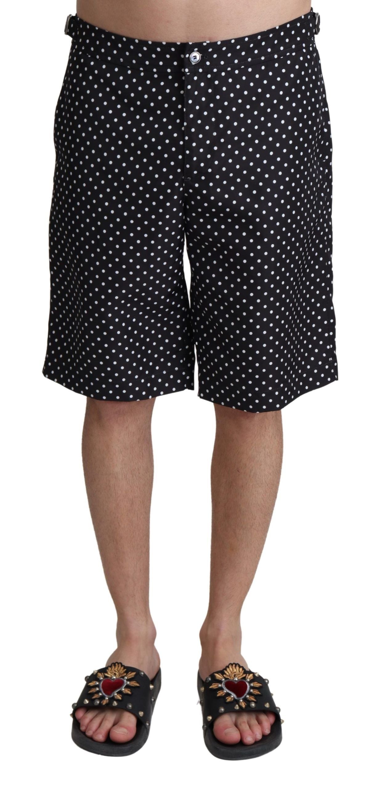 Black polka dots Dolce & Gabbana beachwear shorts with swimwear design, featuring a stylish and comfortable fit for beach outings.
