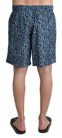 Blue patterned print Dolce & Gabbana beachwear shorts for men, featuring a stylish swimwear design and comfortable fit.