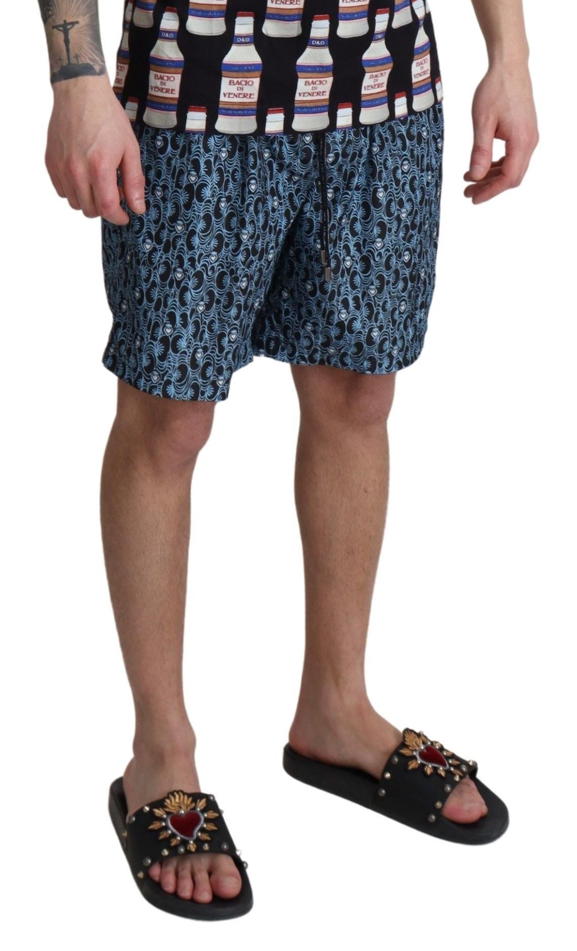 Blue patterned print beachwear shorts by Dolce & Gabbana, featuring a stylish swimwear design with vibrant patterns.