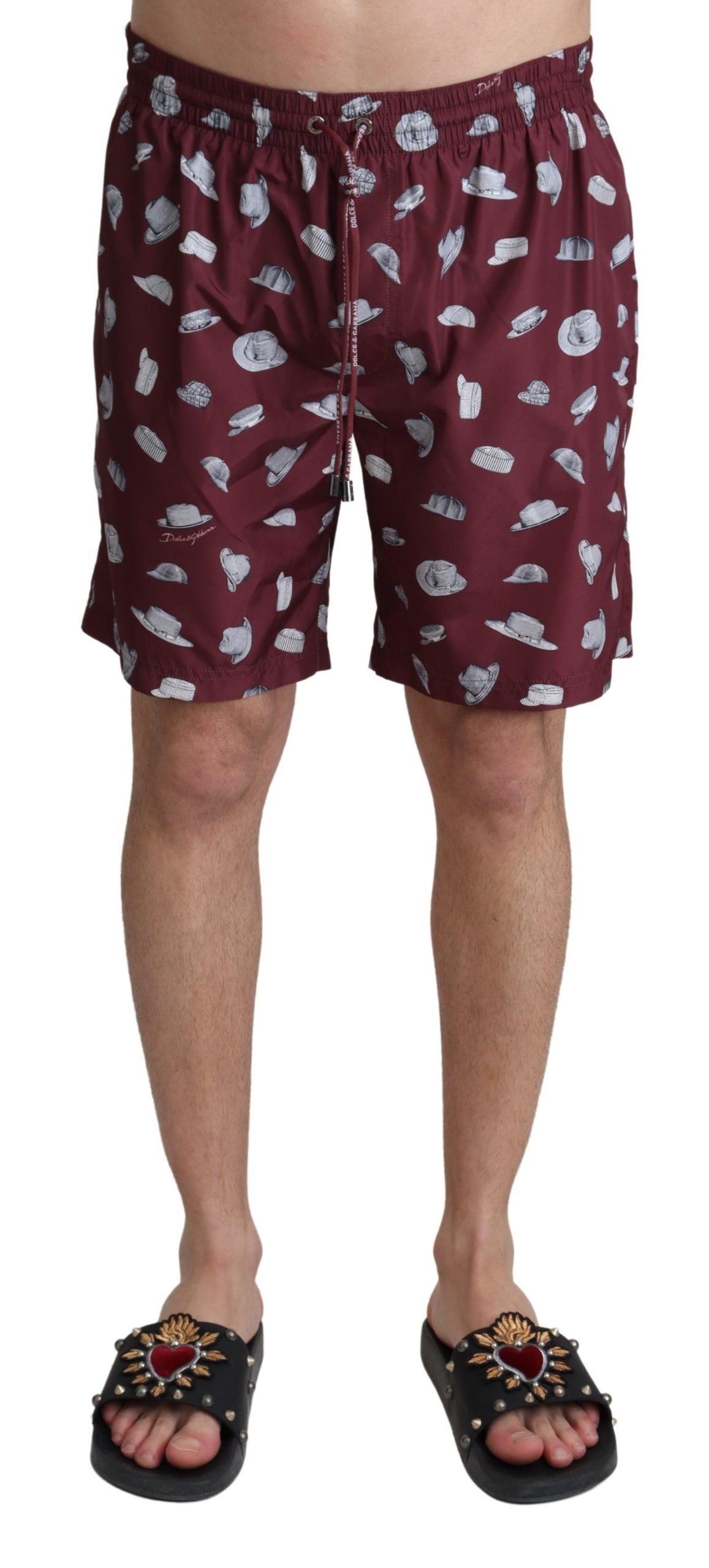 Maroon Dolce & Gabbana beachwear shorts with a printed design, suitable for swimming and casual beach outings.