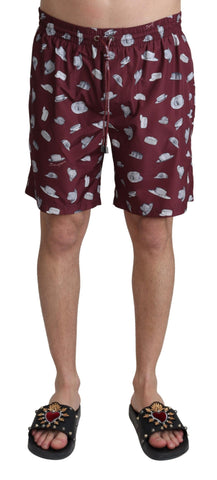 Maroon Dolce & Gabbana beachwear shorts with a printed design, suitable for swimming and casual beach outings.