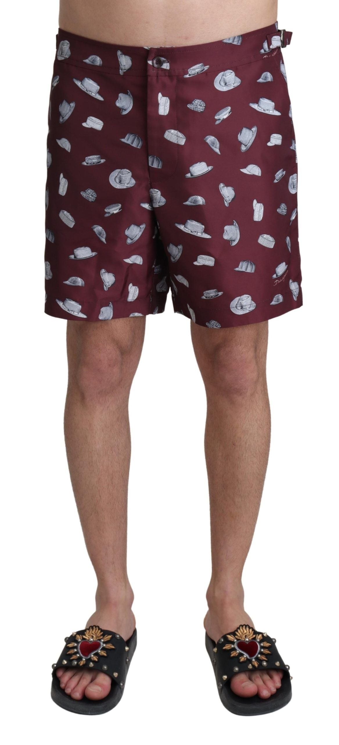 Maroon Dolce & Gabbana beachwear shorts with print design, ideal for swimwear or casual beach outings.