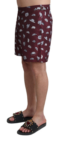 Maroon Dolce & Gabbana beachwear shorts with print design, suitable for swimming and beach activities.