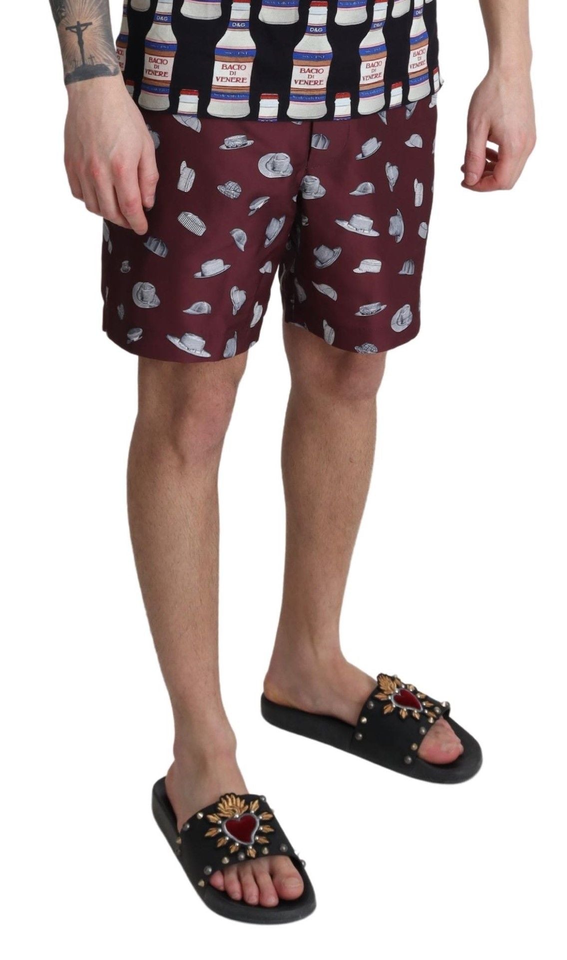 Maroon Dolce & Gabbana beachwear shorts with print design, styled for swimwear or casual beach outings.