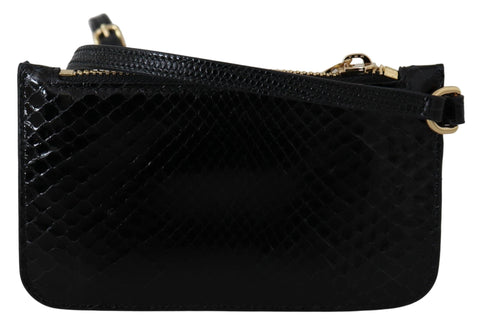 Black leather coin purse wristlet with mirror from Dolce & Gabbana, featuring sleek Agnese wallet design.