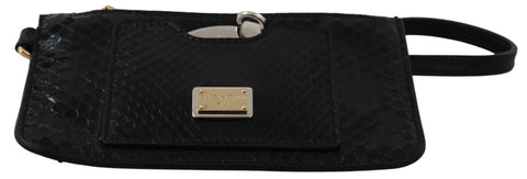 Black leather coin purse wristlet with built-in mirror, Agnese wallet by Dolce & Gabbana, compact and stylish accessory.