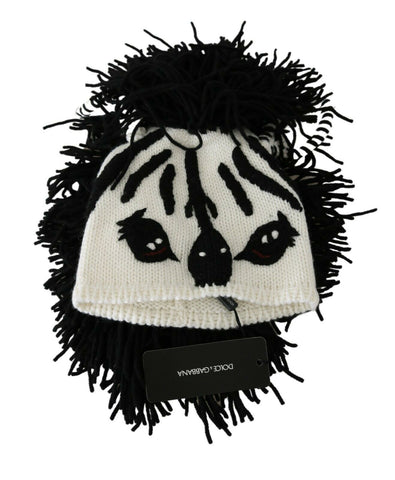 Black and white knitted cashmere hat with an animal design by Dolce & Gabbana, featuring a cozy, stylish winter accessory.