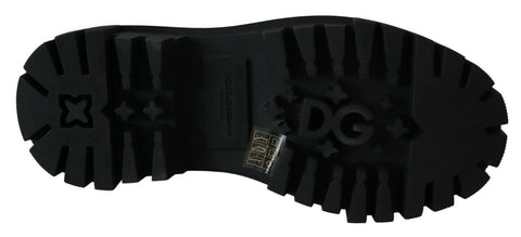 Black leather combat boots with crystal embellishments by Dolce & Gabbana, featuring rugged soles and lace-up design.