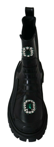 Black leather combat boots with crystal embellishments by Dolce & Gabbana, featuring rugged soles and lace-up design.