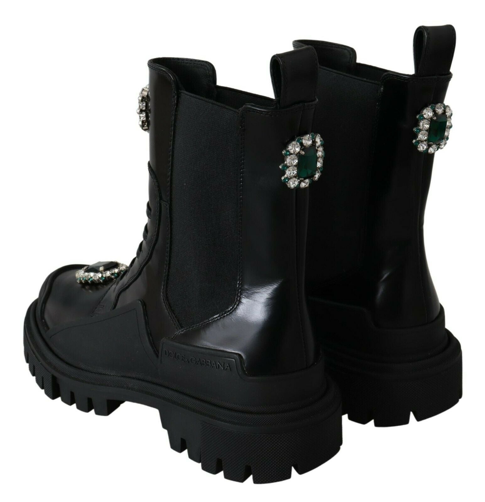 Black leather combat boots with crystal embellishments from Dolce & Gabbana, featuring rugged soles and stylish lace-up design.