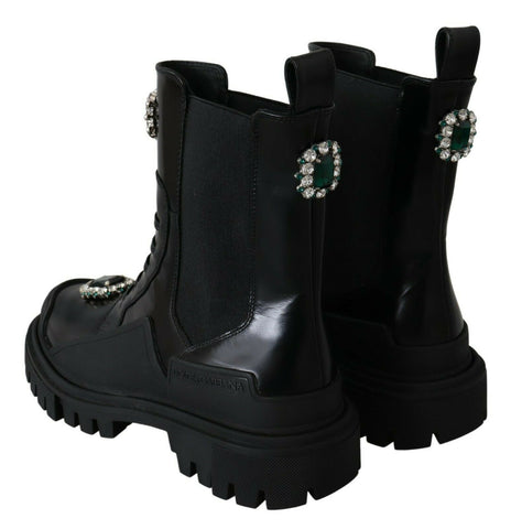 Black leather combat boots with crystal embellishments from Dolce & Gabbana, featuring rugged soles and stylish lace-up design.