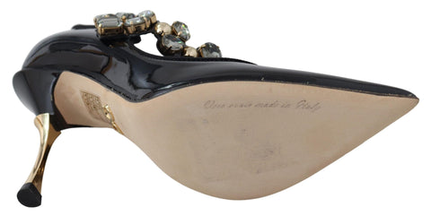 Black leather Mary Jane pumps with crystal embellishments by Dolce & Gabbana, featuring a classic design and elegant style.