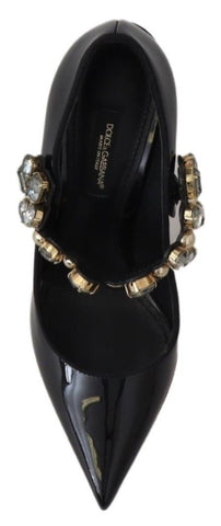 Black leather Mary Jane pumps with crystal embellishments from Dolce & Gabbana, featuring a classic shoe design and elegant buckle strap.