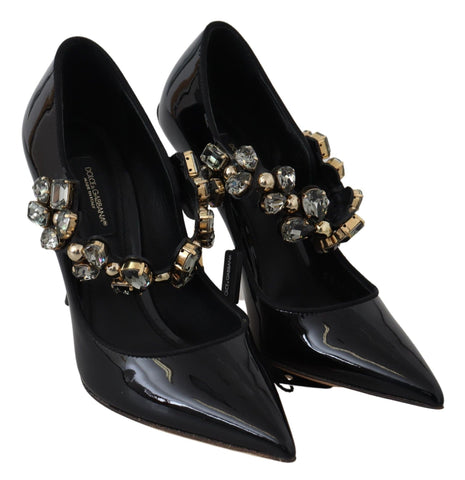Black leather Mary Jane pumps with crystal embellishments by Dolce & Gabbana, featuring a classic strap and pointed toe design.