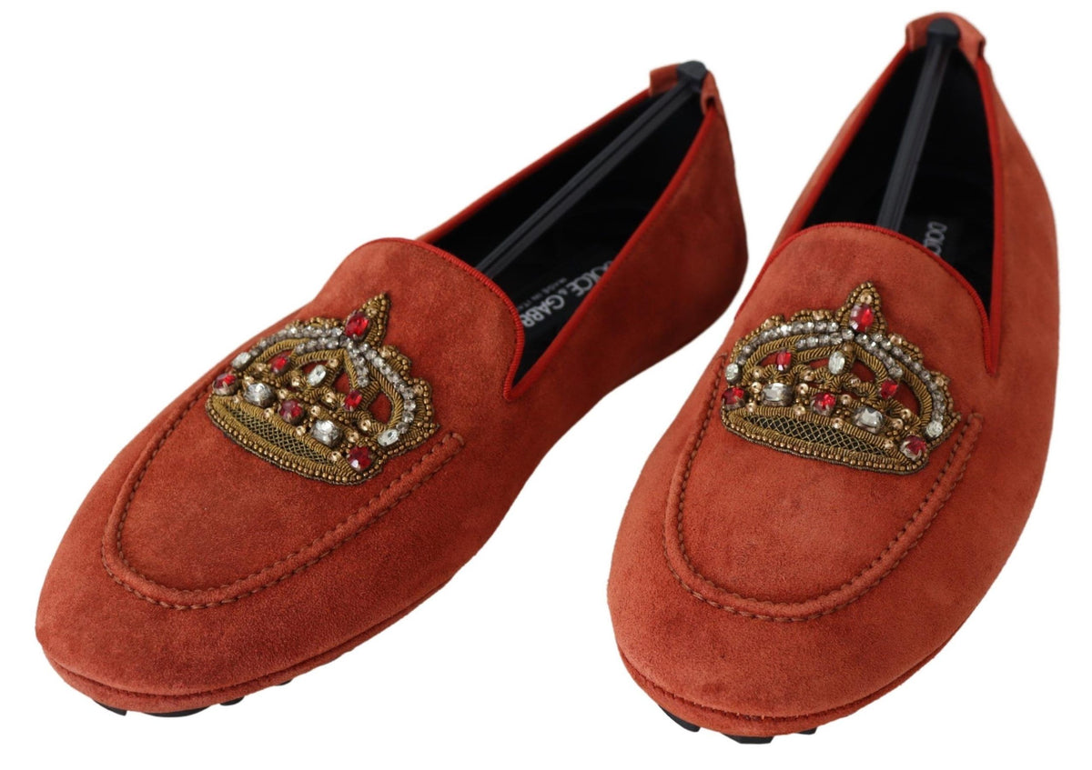 Orange leather crystal crown loafers by Dolce & Gabbana with decorative crown embellishments and sleek slip-on design.