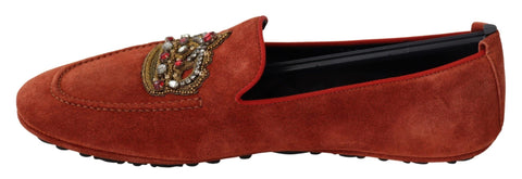 Orange leather Dolce & Gabbana crystal crown loafers with decorative embellishments and stylish design.