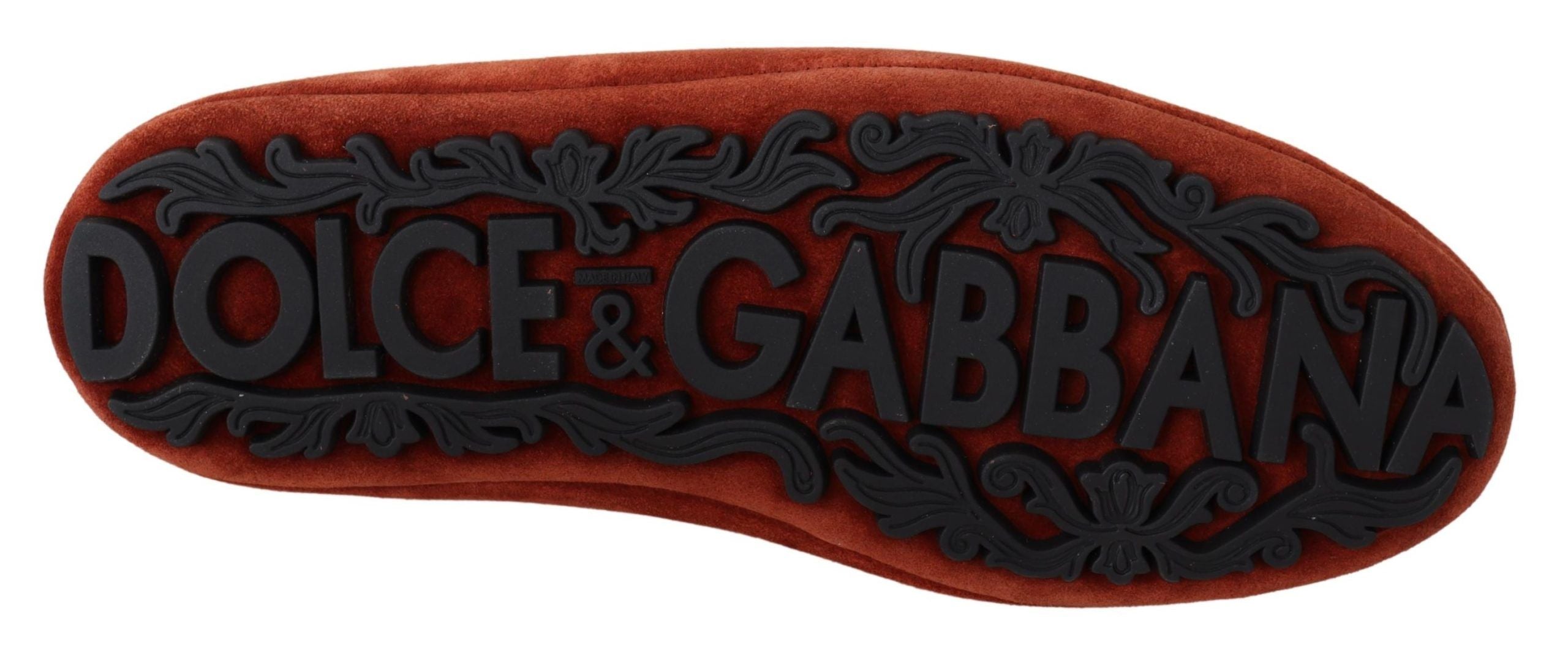 Orange leather loafers with crystal crown embellishment by Dolce & Gabbana, featuring a stylish and luxurious design.