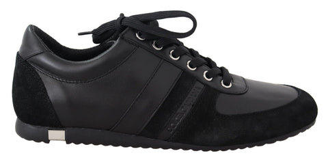 Black leather casual sneakers with Dolce & Gabbana logo branding, stylish and comfortable footwear for everyday wear.