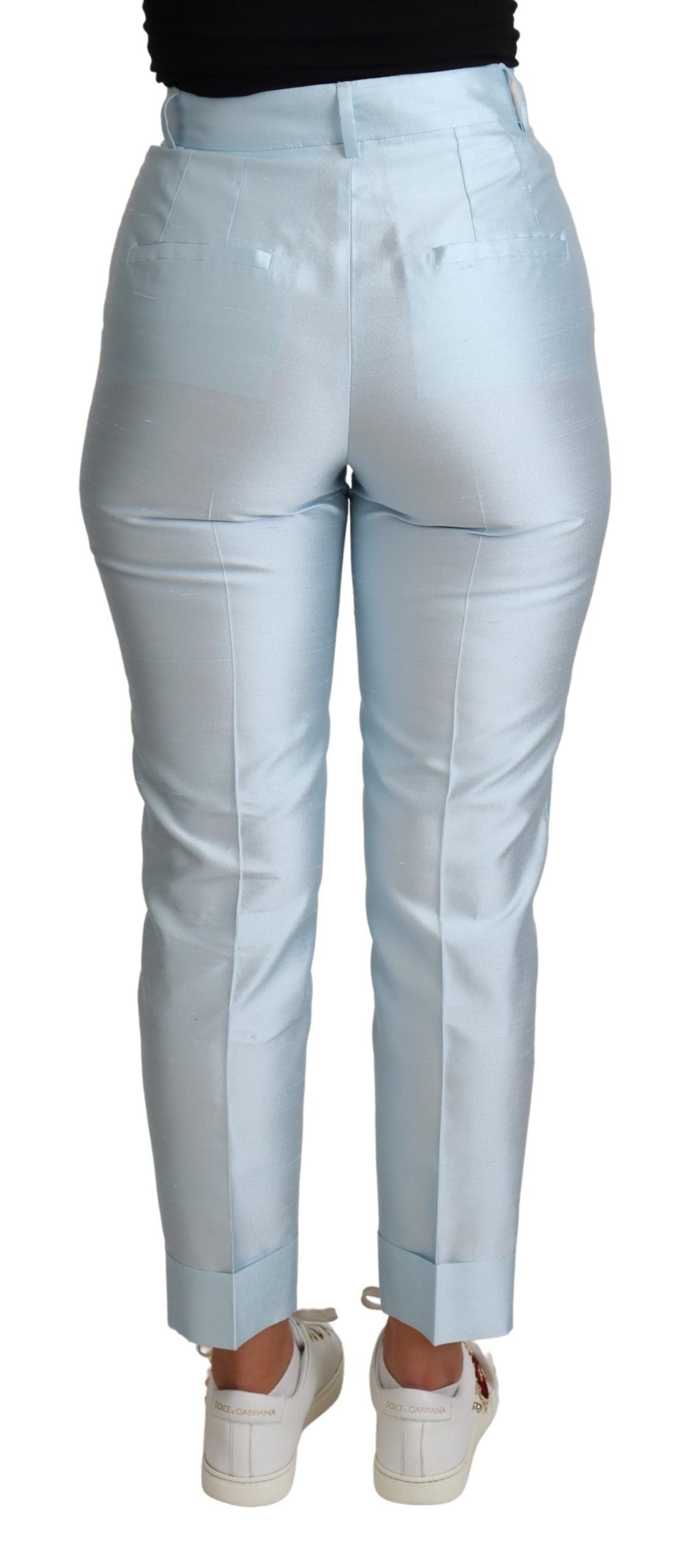 Light blue silk cropped tapered trouser pants by Dolce & Gabbana, showcasing smooth fabric and tailored fit.