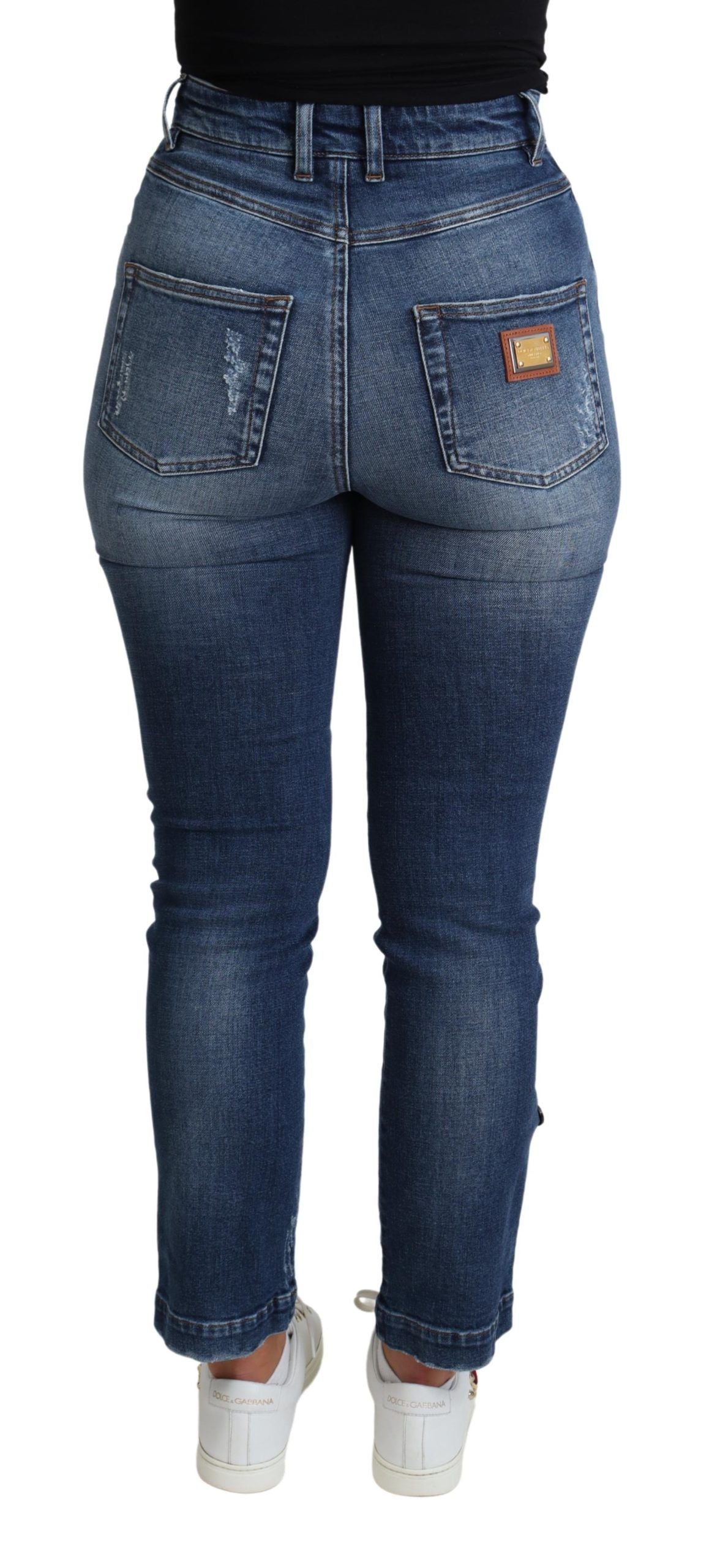 Blue embellished skinny cotton jeans from Dolce & Gabbana with decorative details and a fitted trouser silhouette.