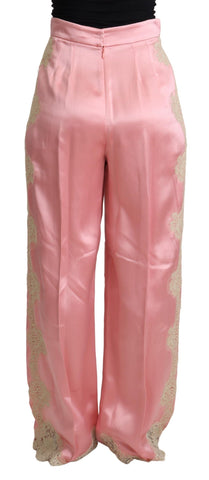 Pink silk satin wide-leg pants with lace trim from Dolce & Gabbana, featuring a smooth, flowing fabric and elegant design.