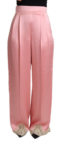 Pink silk satin wide-leg pants with lace trim by Dolce & Gabbana, featuring a smooth, flowing fabric and elegant wide-leg design.