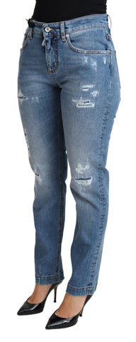 Blue tattered skinny denim jeans by Dolce & Gabbana, showing distressed cotton blend fabric and fitted silhouette.