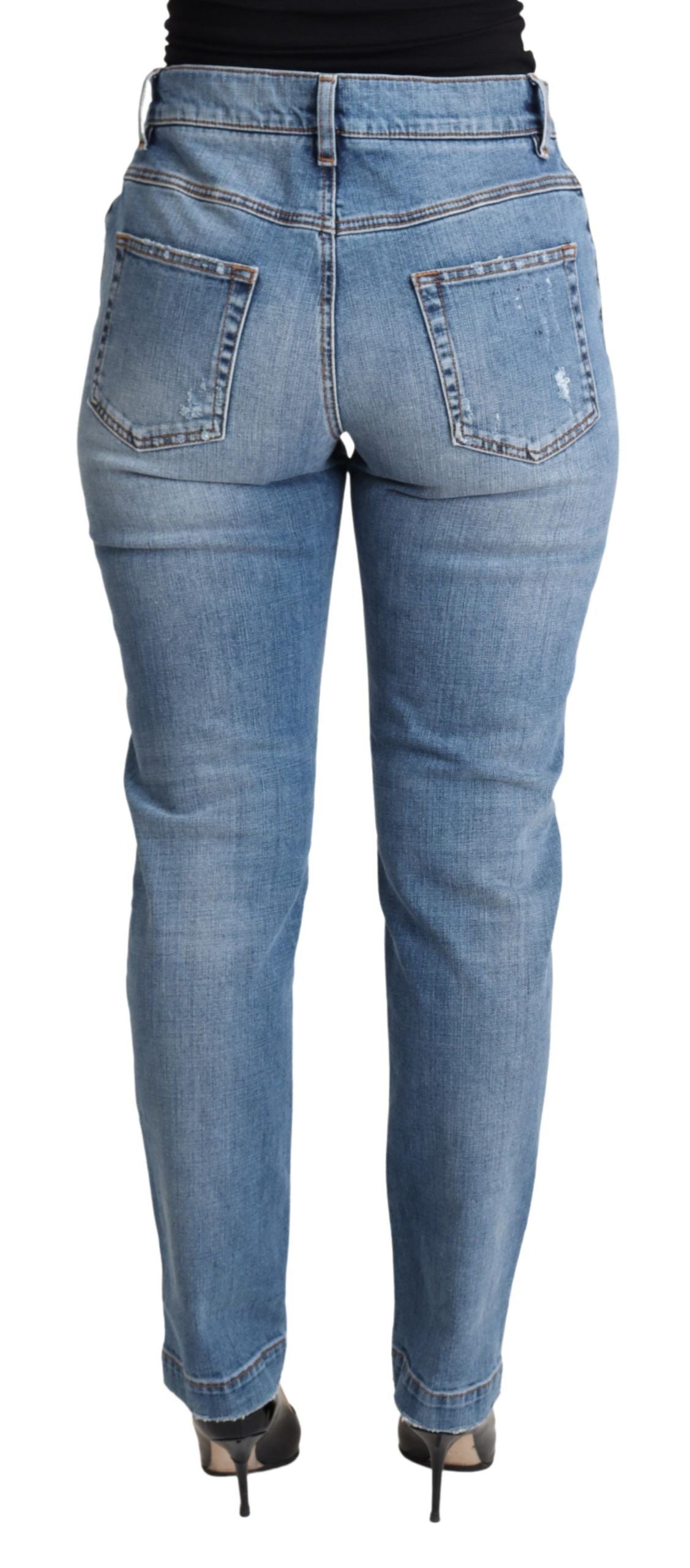 Blue tattered skinny denim jeans by Dolce & Gabbana, made from cotton blend with distressed detailing and a fitted silhouette.