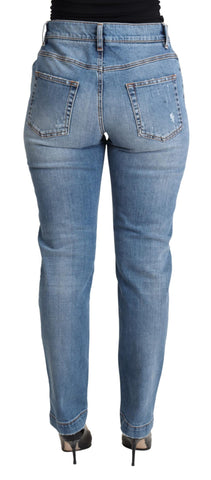 Blue tattered skinny denim jeans by Dolce & Gabbana, made from cotton blend with distressed detailing and a fitted silhouette.