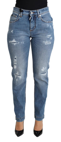 Blue tattered skinny denim jeans by Dolce & Gabbana, made from cotton blend, shown with distressed details and slim fit silhouette.