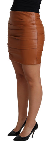 Brown lambskin high waist mini pleated skirt by Dolce & Gabbana, showcasing its textured leather and stylish design.