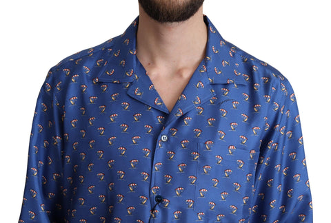 Blue silk shirt with beach umbrella print by Dolce & Gabbana, featuring a relaxed fit and stylish design.