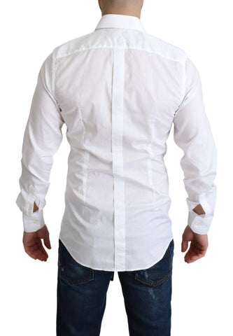 White cotton long sleeve formal shirt by Dolce & Gabbana displayed on a hanger, showcasing its classic collar and tailored fit.