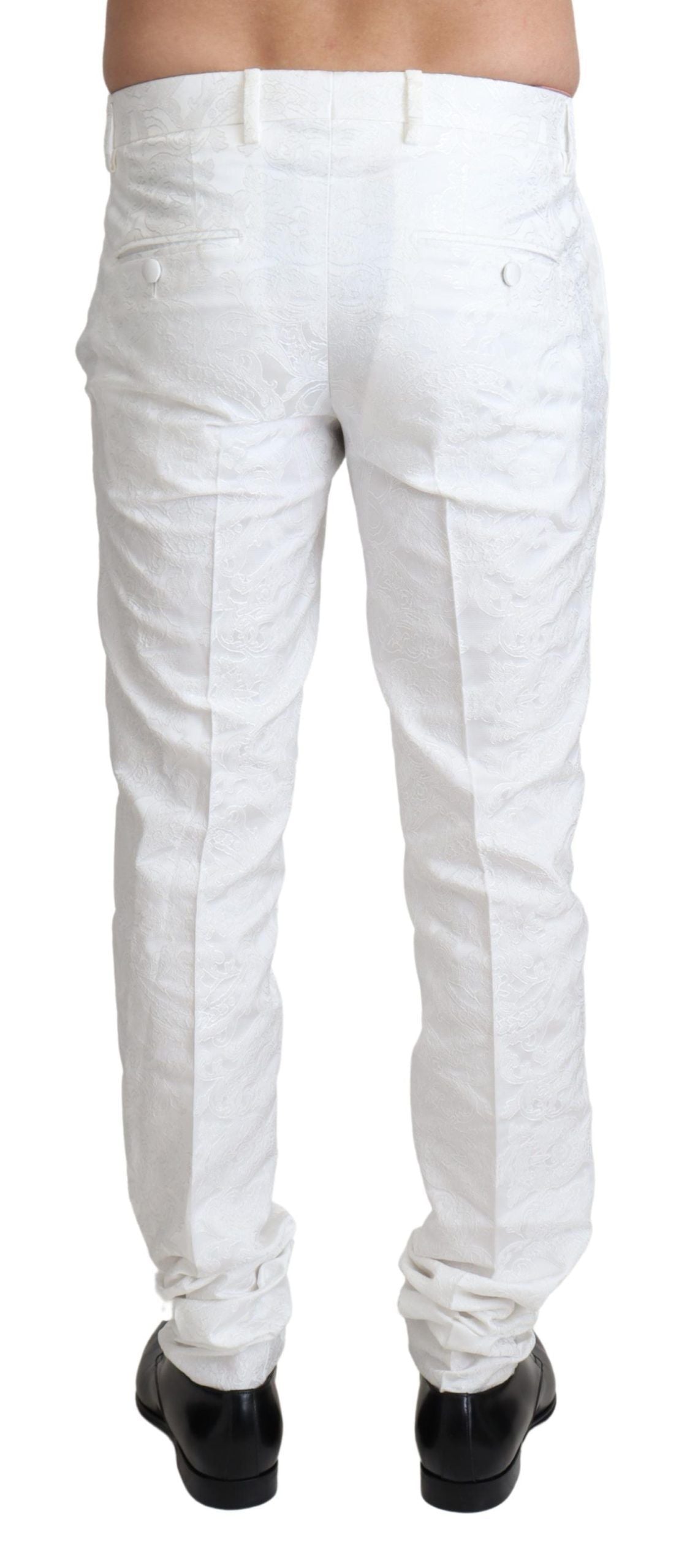 White brocade jacquard dress trouser pants by Dolce & Gabbana, featuring intricate woven patterns and tailored fit.