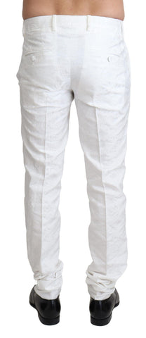 White brocade jacquard dress trouser pants by Dolce & Gabbana, featuring intricate woven patterns and tailored fit.