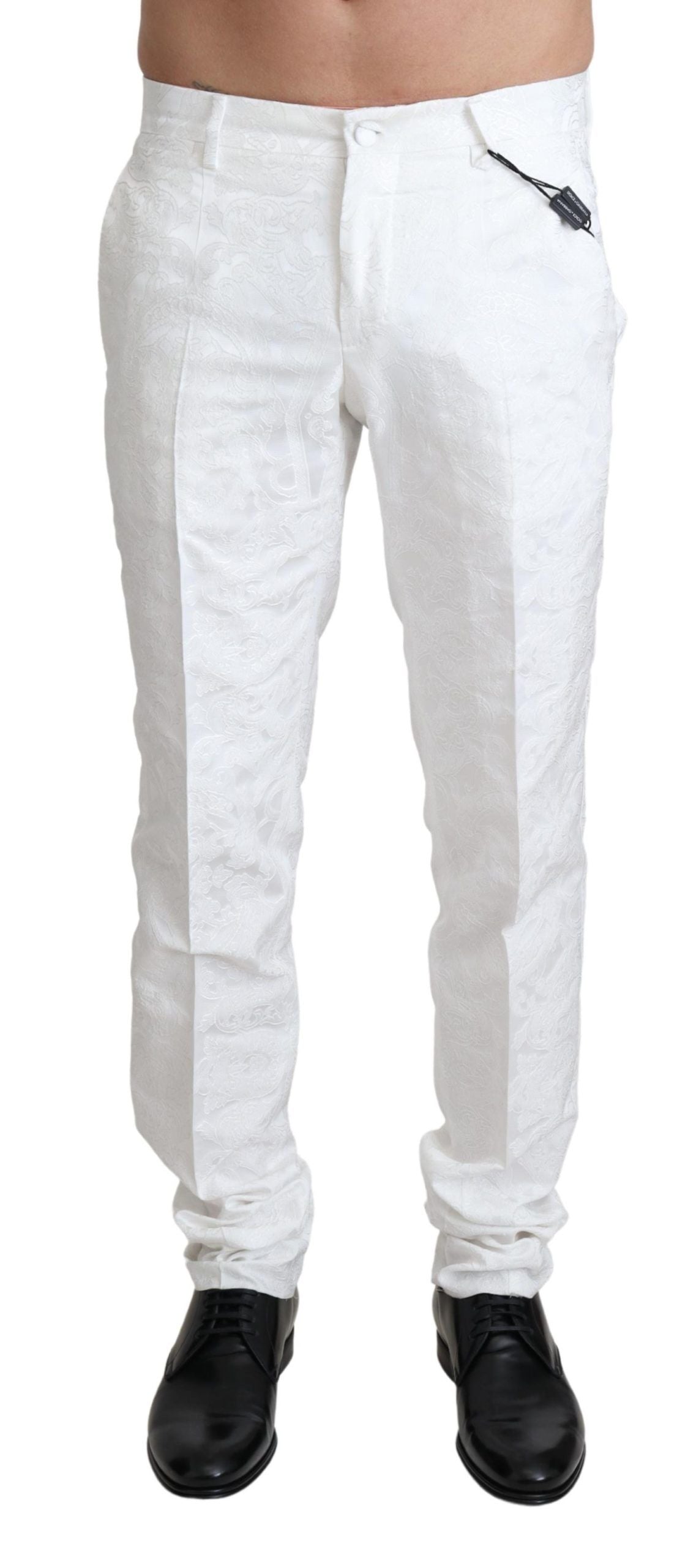 White brocade jacquard dress trouser pants by Dolce & Gabbana, featuring intricate floral pattern and tailored fit.