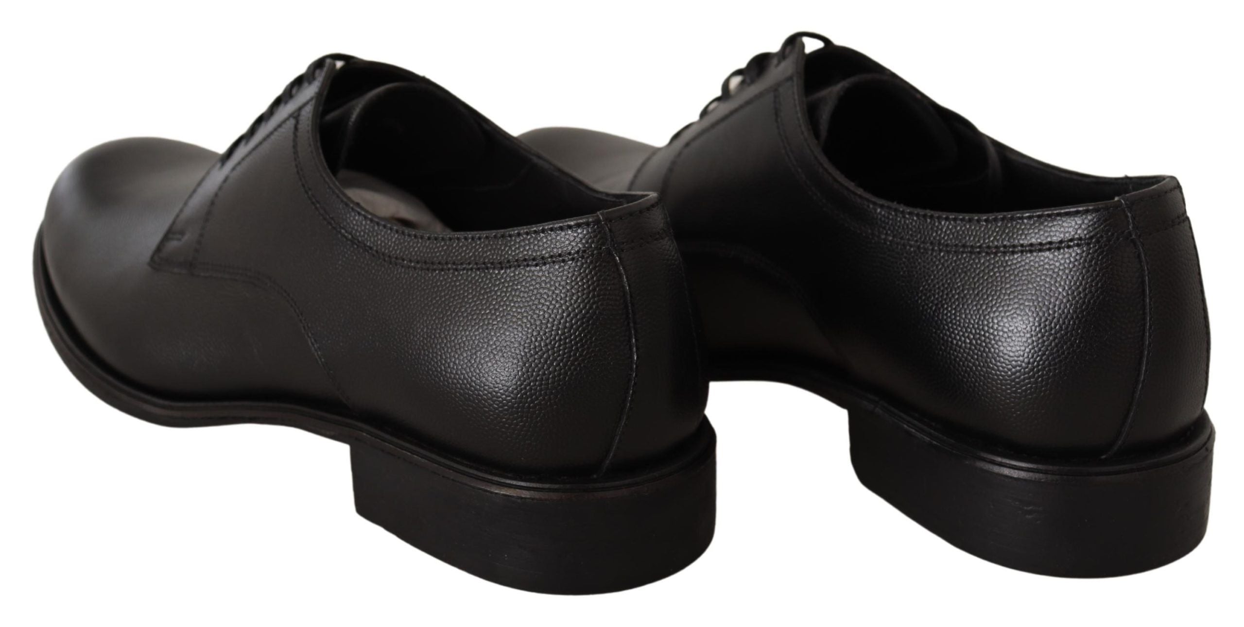 Black leather lace-up men's formal derby shoes by Dolce & Gabbana, featuring a sleek design and polished finish.